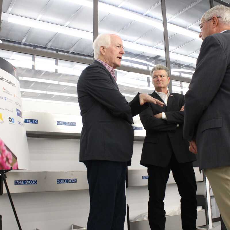 U.S. Senator John Cornyn, R-Texas, speaks with Texas Tech University Chancellor Dr. Tedd Mitchell and Joe Heppert, TTU vice president of research and innovation, during a tour of X-FAB Texas on Monday, July 17, 2023 in Lubbock.